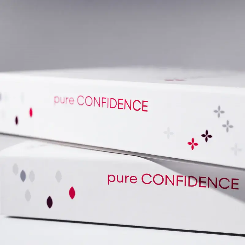 Pure Confidence product packaging for wellness and skincare solutions