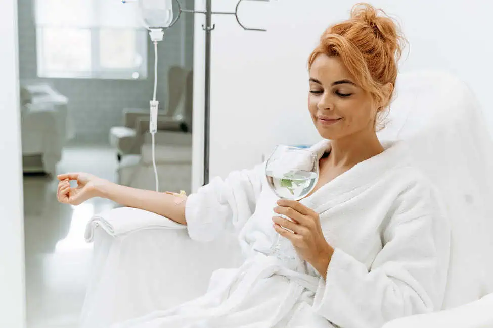 Woman relaxing during IV therapy for hydration and wellness.